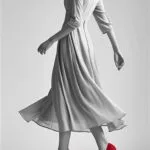 chinese-female-in-fashionable-dress-wearing-red-e51919-high-heel-shoes-in-black-white-except-for-the-shoes.-show-neck-or-below-do-not-show-face_-her-posture-can-be-more-movement-sm