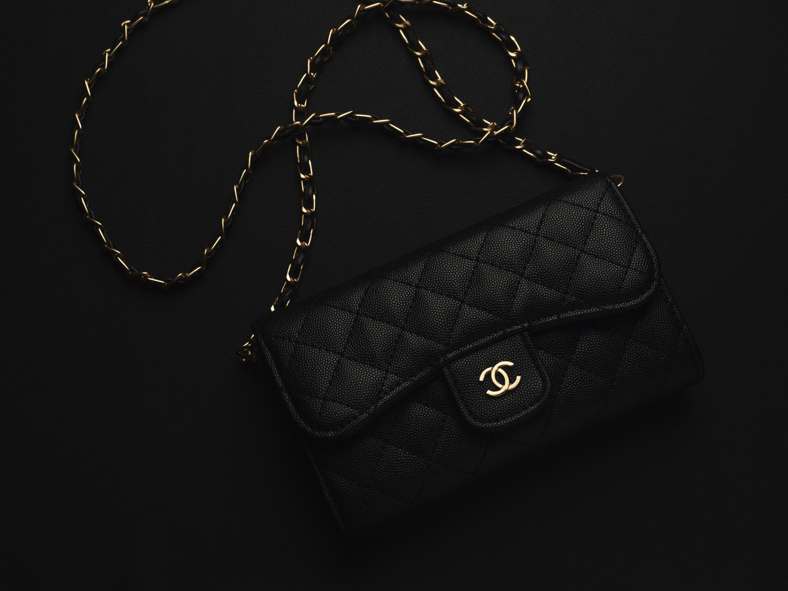 Black Chanel leather bag with golden chain
