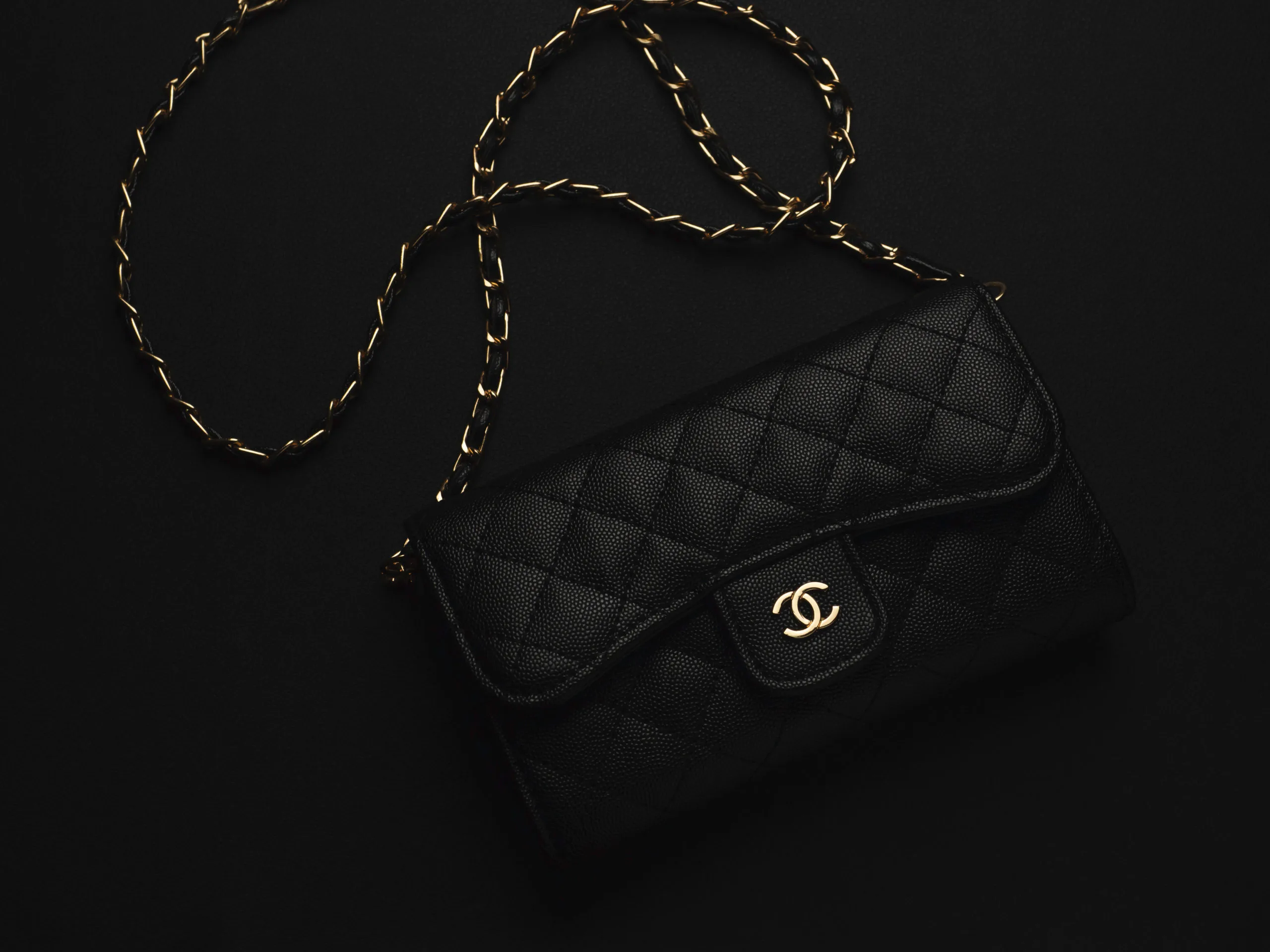 Black Chanel leather bag with golden chain